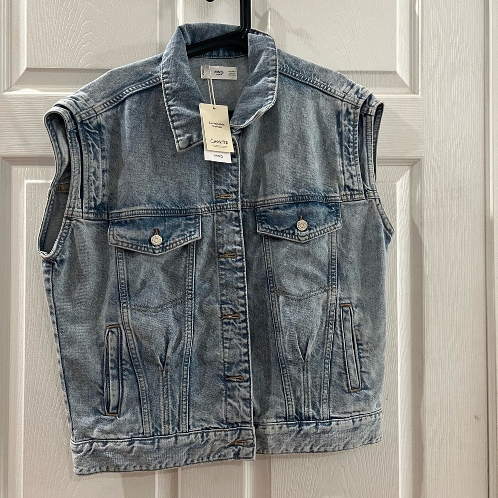 Brand new denim vest absolutely love this vest but it’s to long on my 5 ft frame
